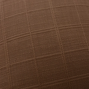 Detailed macro view of brown double-sided jacquard polyester pillowcase texture