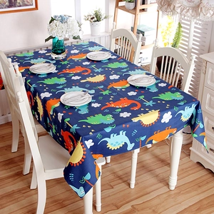Thick cotton tablecloth featuring colorful cartoon dinosaurs on a dark blue background