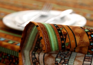 Close-up of geometric pattern cotton linen tablecloth with delicate lace edging