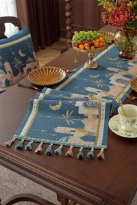 Detailed jacquard table runner featuring moon motifs and elegant fringe tassels
