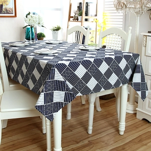 Detailed close-up of Japanese cotton-linen tablecloth featuring wavy lace edges and grid pattern