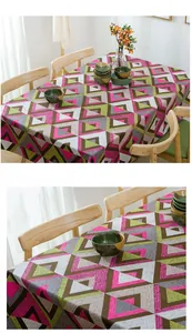 Close-up of geometric cotton canvas tablecloth with colorful triangular patterns and drape