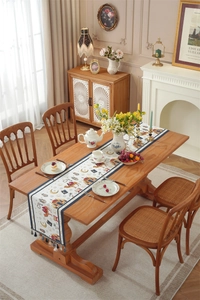 Detailed texture of blue tassel and ethnic camel moon pattern on table runner