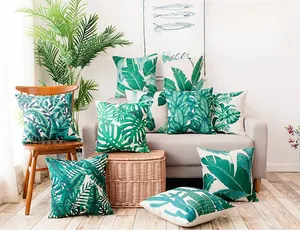 Close-up of tropical palm leaf pattern on thick linen cushion cover with rustic texture