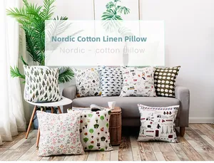 Detailed collection of Nordic cotton linen pillows with diverse graphic prints on a sofa