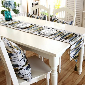 Modern colorful striped table runner with green tassels and matching pillow set