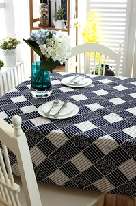 Detail of Japanese zakka tablecloth with navy blue wave pattern and cotton lace edge