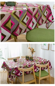 Detail of thick cotton canvas tablecloth showing geometric diamond pattern texture and seams