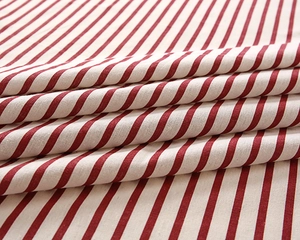 Macro view of woven red and white striped fabric texture for rectangular tablecloth
