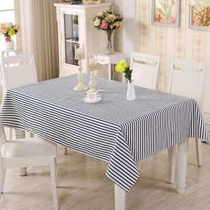 Detailed texture of blue and white striped cotton-polyester rectangle tablecloth for dining