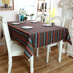 Detail of colorful bohemian striped cotton linen tablecloth with elegant lace edges