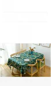 Detailed view of thick canvas tablecloth with green leaf print and reactive dyeing