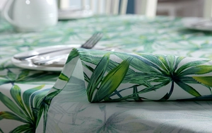 Macro view of tropical palm leaf print on thick cotton fabric with stitched hem edge