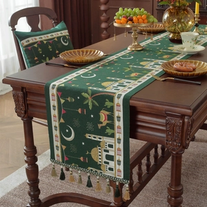 Dark green Ramadan table runner with tassels featuring mosque moon and camel patterns