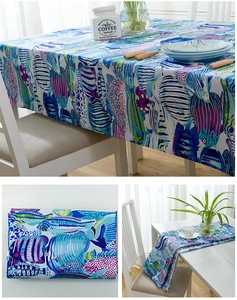 Detailed view of colorful tropical fish pattern on thick cotton tablecloth and runner