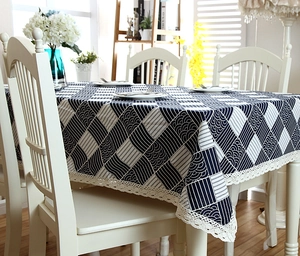 Detail of navy checkerboard cotton tablecloth with scalloped white lace crochet edge