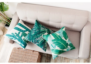Close-up of tropical palm and cactus leaf prints on heavy cotton linen pillow covers