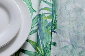 Close-up of tropical palm leaf pattern on thick cotton canvas tablecloth with neat stitching