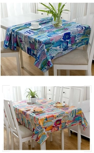 Detail of cotton tablecloth showing hand-drawn tropical fish patterns in vibrant colors