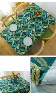 Close-up of thick cotton tablecloth with tropical leaf patterns and overlock stitching