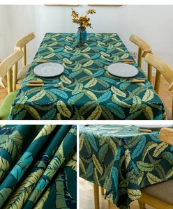 Detailed close-up of thick cotton canvas tablecloth with tropical banana leaf print
