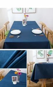 Detail of navy blue linen textured tablecloth with macro fabric weave and hemmed edges