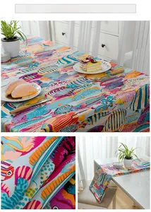 Close-up of thick cotton tablecloth featuring colorful tropical fish pattern and fabric texture