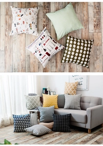 Detail of Nordic plaid and geometric cotton linen cushion covers on a sofa