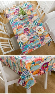 Detail of colorful tropical fish print on thick cotton tablecloth with premium texture