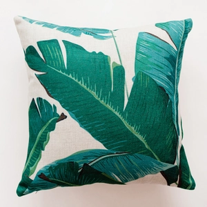 Close-up of tropical banana leaf print on textured heavy cotton linen cushion cover