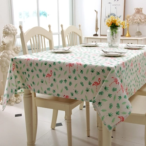 Detail of flamingo and tropical leaf print on cotton linen rectangular tablecloth