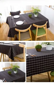 Close-up of modern black and white plaid waterproof tablecloth with fine grid texture