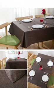 Detail of coffee brown waterproof linen tablecloth with textured fabric on wooden table