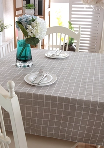 Detail of grey and white checkered rectangle tablecloth with woven cotton texture