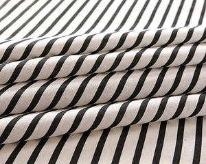 Detailed macro view of soft striped cotton fabric with diagonal black and white patterns