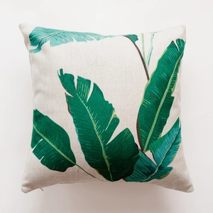 Close-up of tropical green leaf print on heavy linen and cotton blend cushion cover
