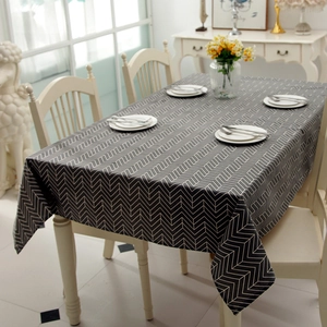 Detail of grey and white geometric chevron pattern on durable poly-cotton tablecloth