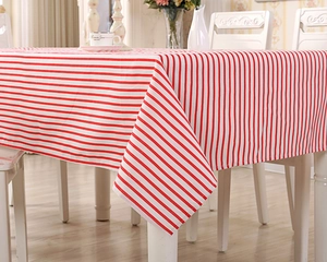 Detail of red and white striped table cloth with a high-quality cotton blend texture