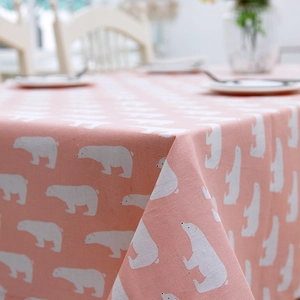 Detailed view of pink cotton linen tablecloth with cute white polar bear pattern