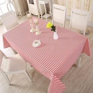 Detail of red and white striped table cloth with premium linen texture and soft draping