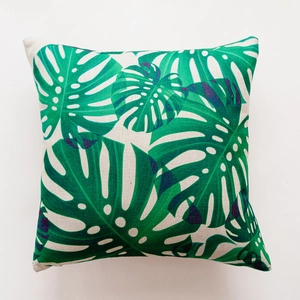 Close-up of Monstera leaf print on heavy cotton linen square cushion cover fabric