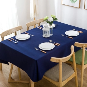 Detail view of navy blue geometric tablecloth with premium waterproof yarn-dyed fabric