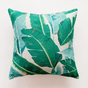 Close-up of tropical green leaves printed on textured linen cotton square pillowcase