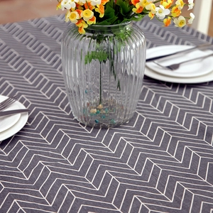 Modern minimalist herringbone pattern table cloth with grey geometric lines and dining decor