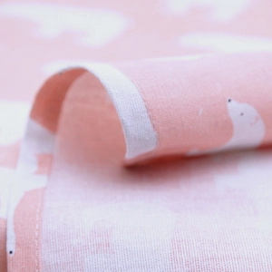 Close-up of pink polar bear tablecloth showing soft fabric texture and neat stitching