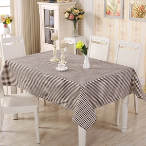 Detail of coffee and white checkered tablecloth texture with smooth stitched edges