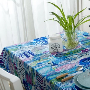 Thick cotton tablecloth featuring colorful tropical fish pattern in deep blue tones