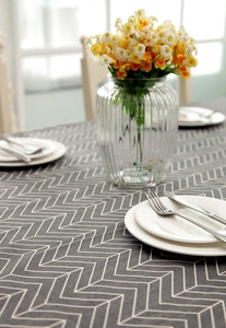 Detail of grey chevron polyester-cotton tablecloth with a thick woven fabric texture
