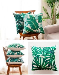 Detail view of heavy cotton linen pillow covers with tropical leaf and cactus prints
