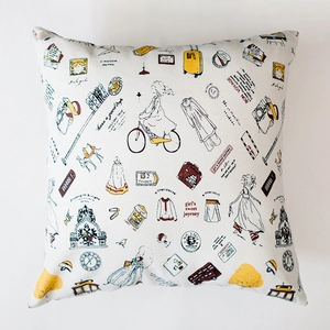 Detail of travel-themed cotton linen pillow case with hand-drawn landmarks and bus prints